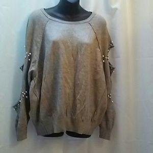 Elan long sleeve top with peek a boo sleeves